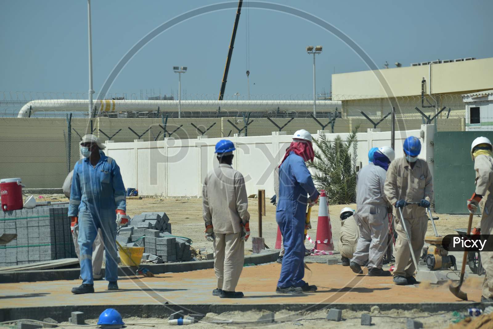 Construction Workers Digging Trench Using Shovels. Abu Dhabi,Uae.03.10.2020.