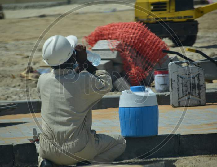 Man Drink Water In A Hot Summer Day, Worker Male Have A Break Time.Abu Dhabi,Uae.03.10.2020.