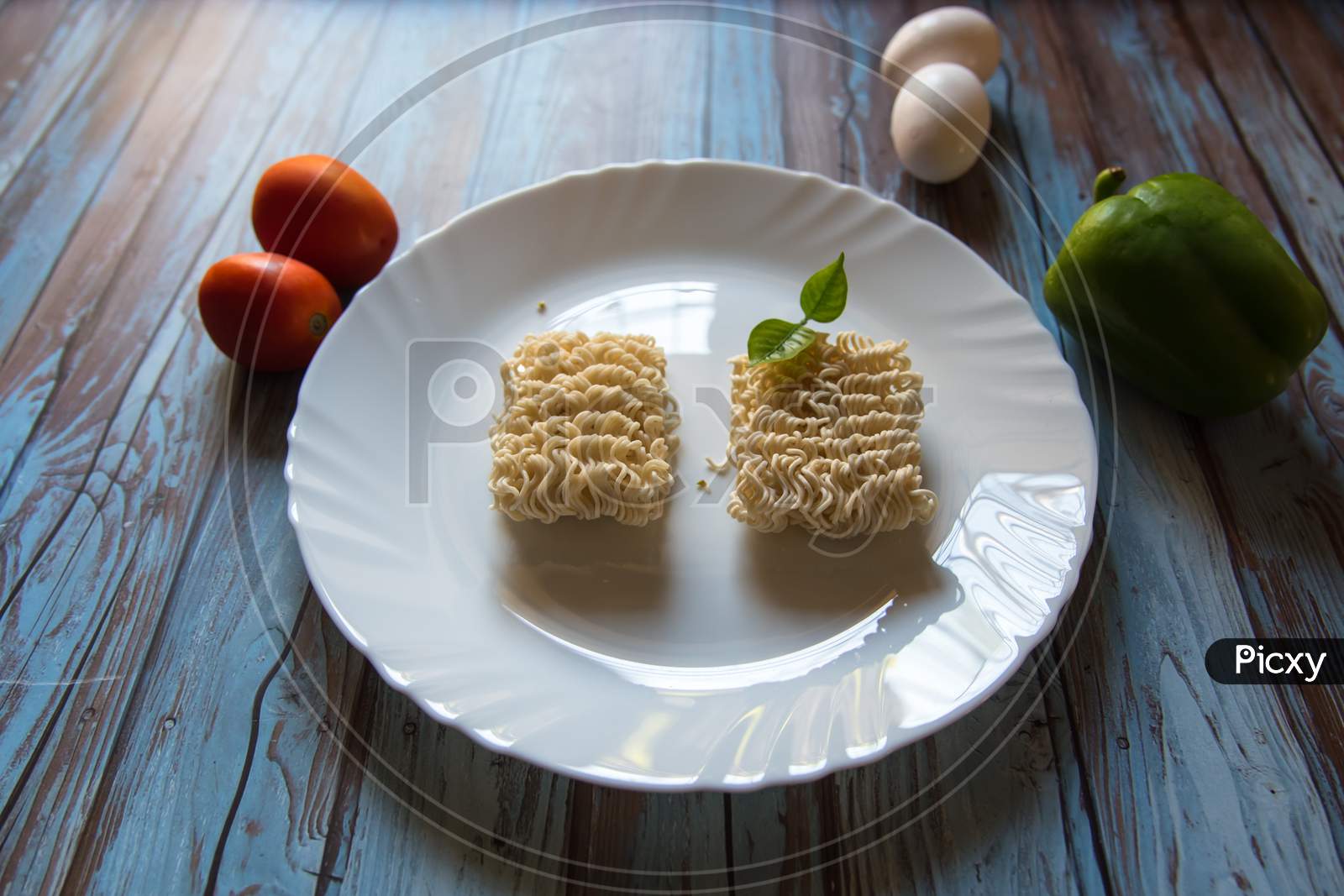 A plate of uncooked ramen noodles