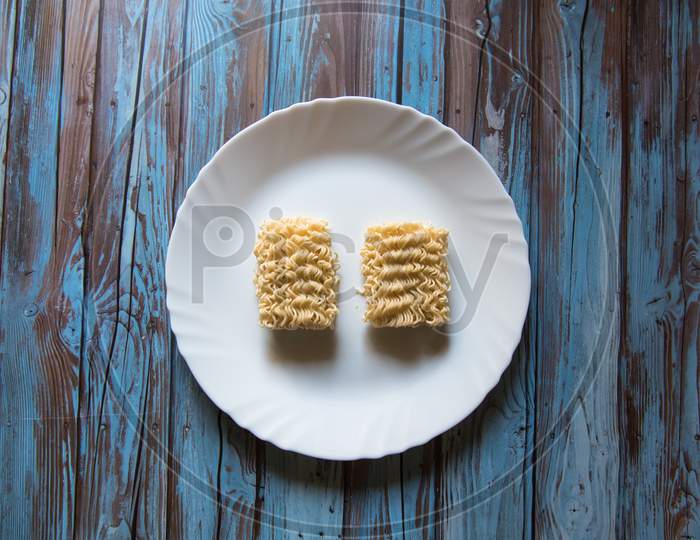 Top view of instant noodles in a white plate
