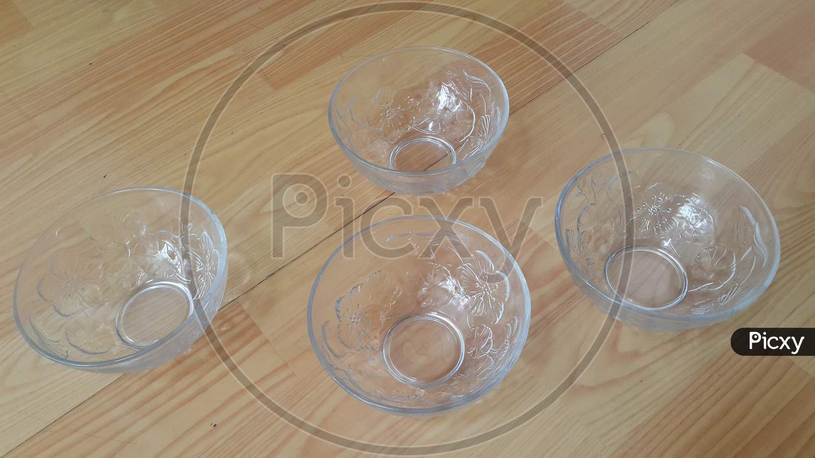Top View Of Empty White Glass Bowls On A Wooden Floor