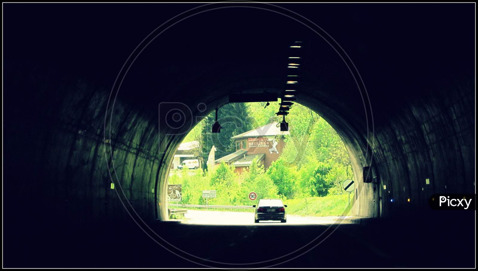 Car at the end of tunnel
