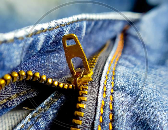 Closeup picture of denim zipper. Macro photography.