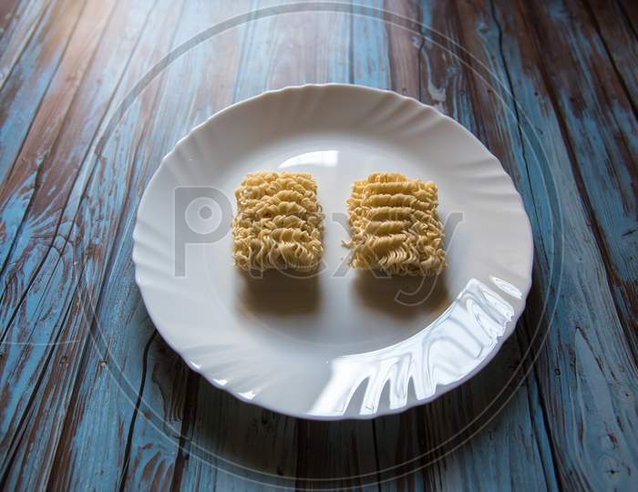 Close up of uncooked instant noodles in a plate