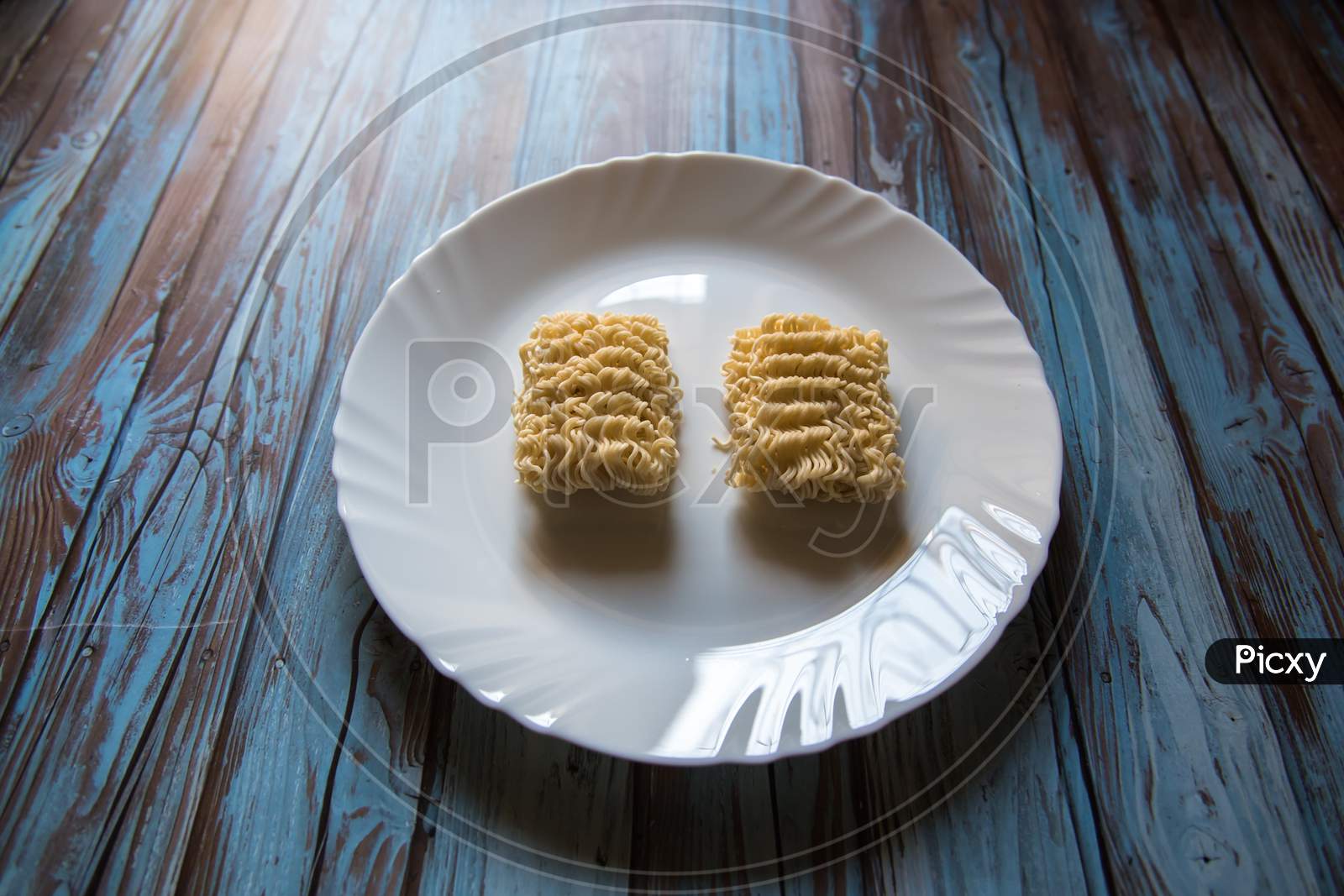 Close up of uncooked instant noodles in a plate