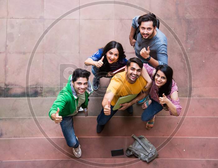Cheerful Indian Asian Young Students Enjoying Togetherness In College Campus Top View