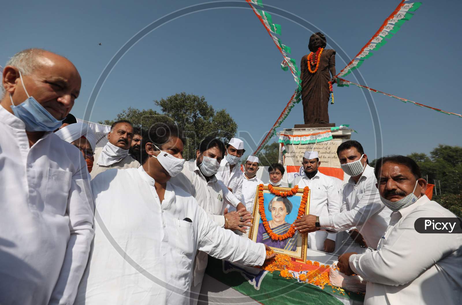 Congress party workers pay floral tribute to former Prime Minister Indira Gandhi on her 36th death anniversary, at Indra chowk in Jammu,31 october,2020.