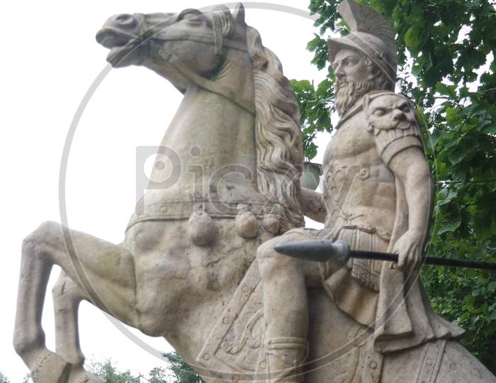 White Marble Statue Of An Ancient Man Holding A Scroll And Riding A Horse