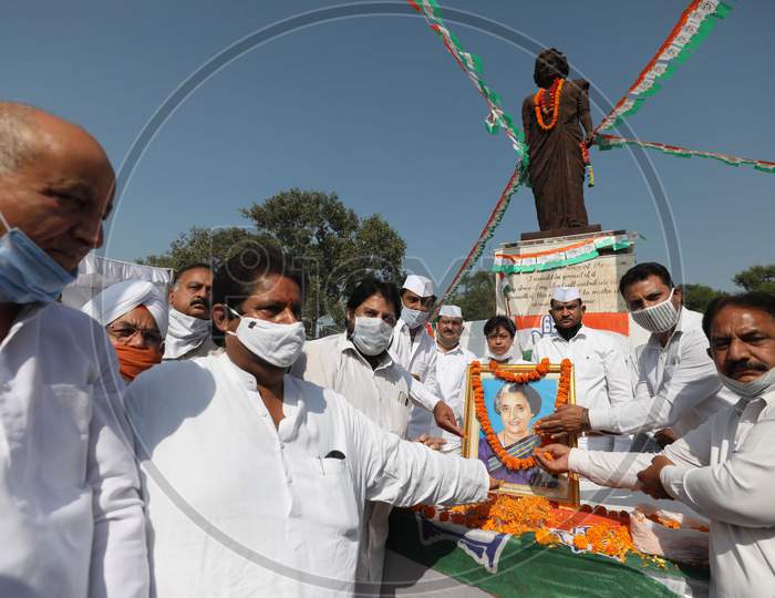 Congress party workers pay floral tribute to former Prime Minister Indira Gandhi on her 36th death anniversary, at Indra chowk in Jammu,31 october,2020.