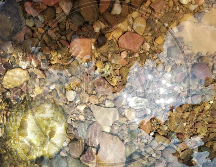 Pebbles and stones in a water sources