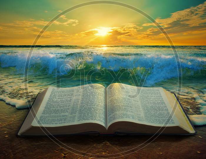Sunrise At The Ocean With A Bible