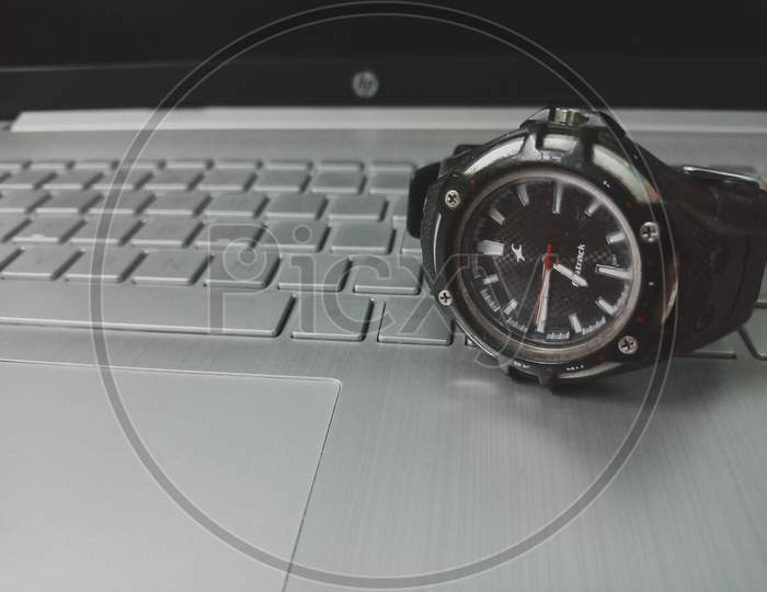 A wrist watch with a unique background