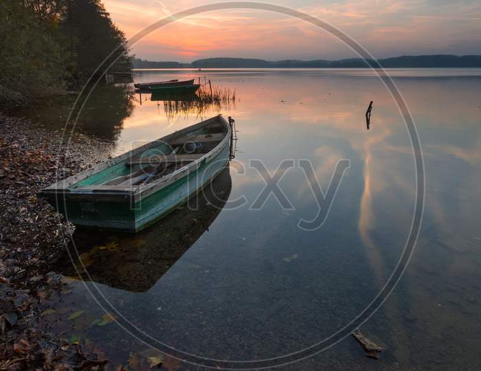 Sunset Lake With Fisherman Boat Landscape.