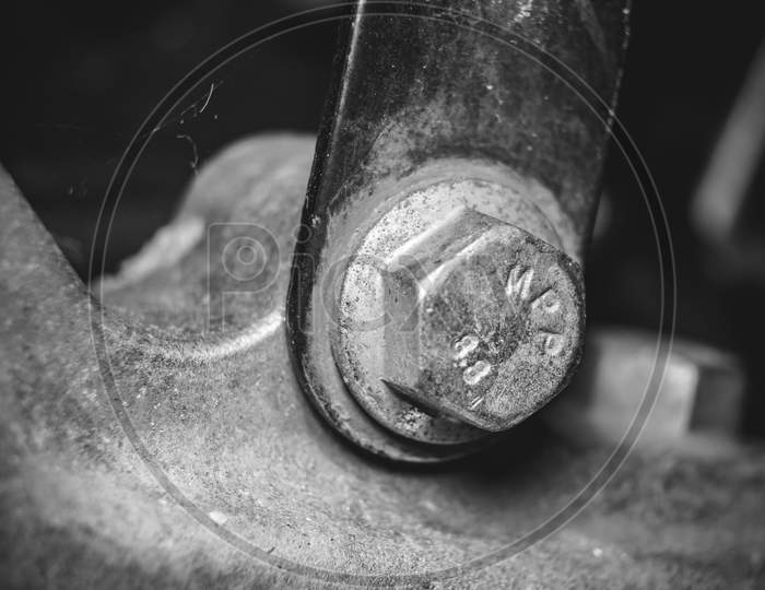 Close Up Photo Of A Corroded Nut And Bolt Of A Bike.