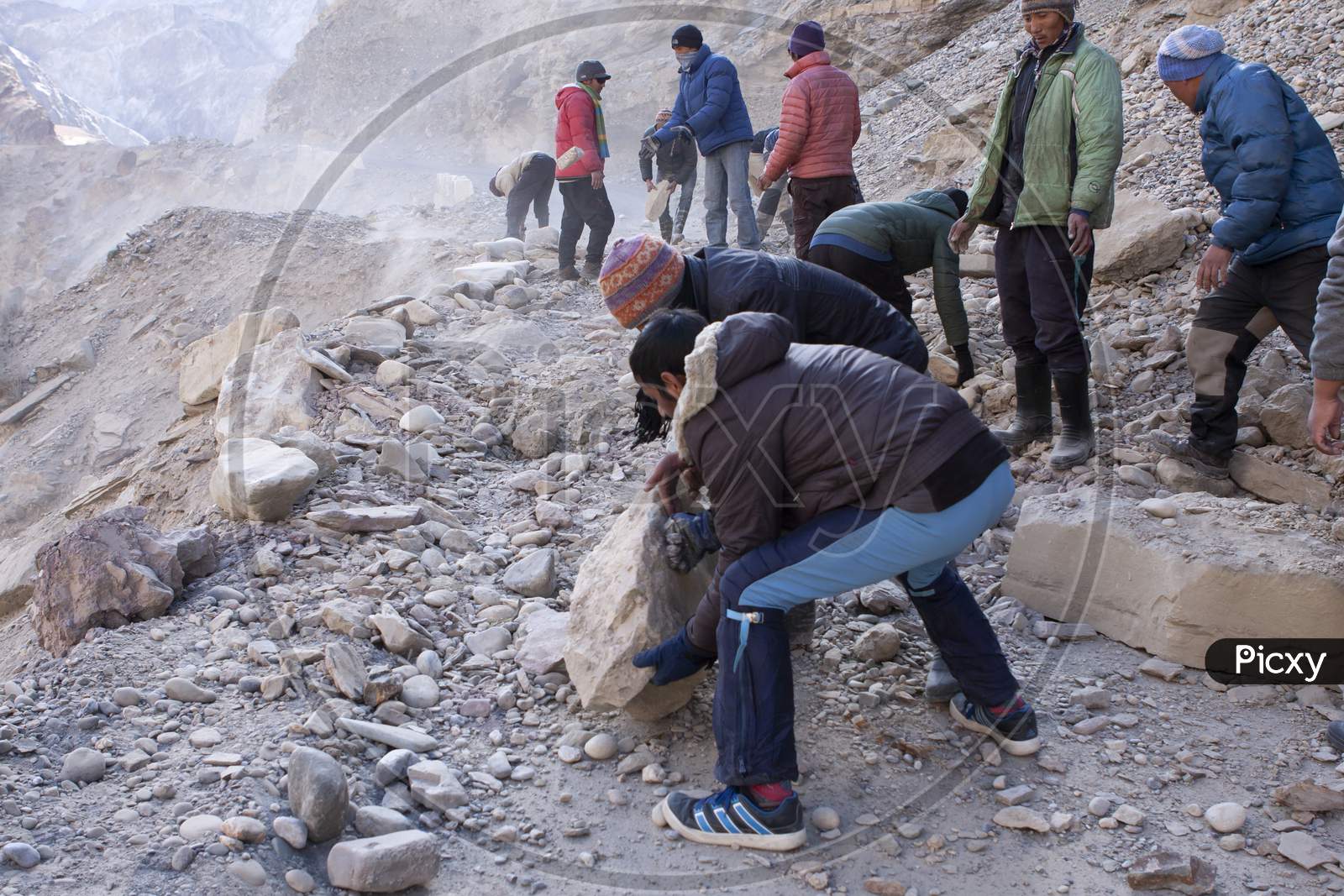 Men Moving Boulders, Clearing Road Blocked Due To Land Slide In A Remote Himalayan High Altitude Road In Ladakh