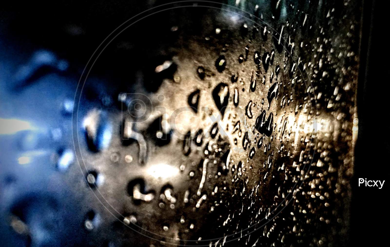 Rain drops on car window glass