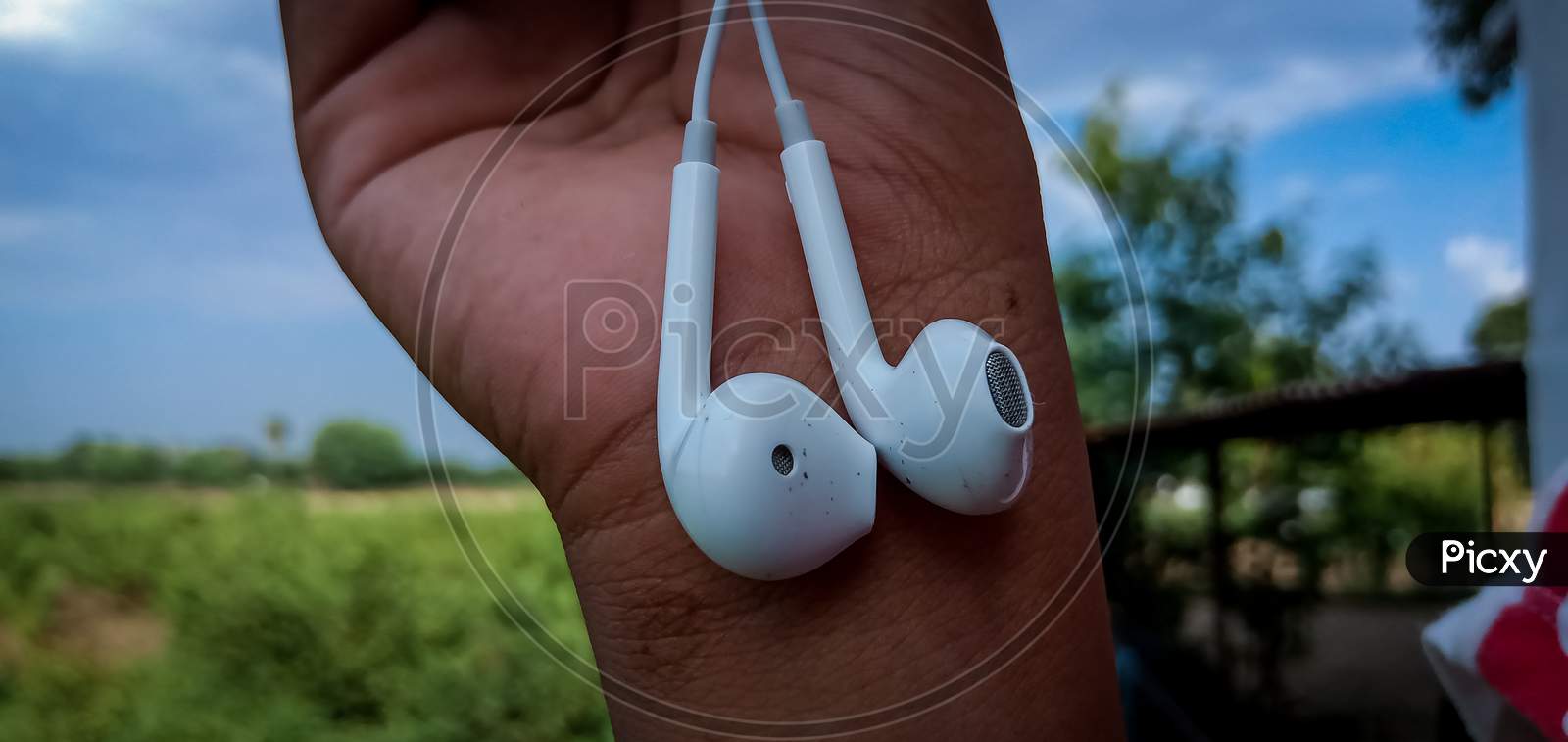 Headphones holding in a hand