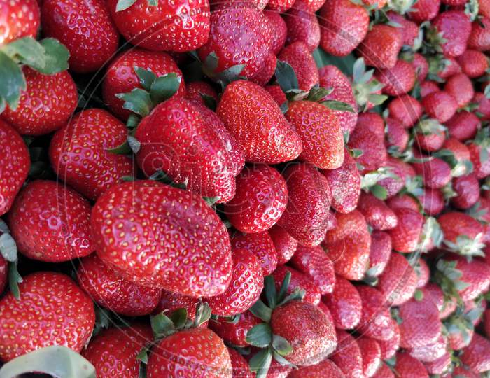 Close-up of fresh strawberries for sale on Indian street market