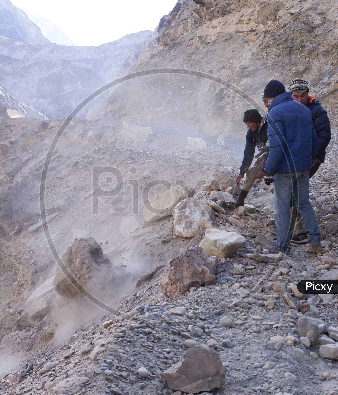 Men Moving Boulders, Clearing Road Blocked Due To Land Slide In A Remote Himalayan High Altitude Road In Ladakh