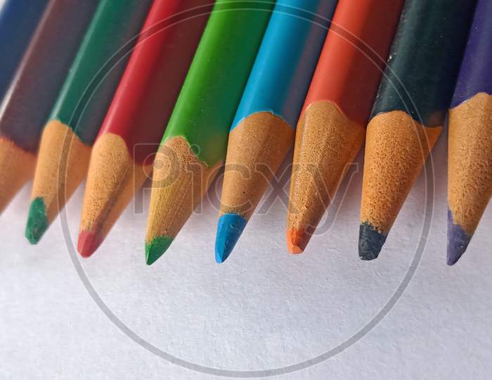 Colored pencils on white paper, multi coloured pencils