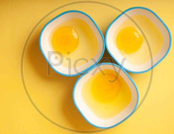 Egg Yellow Yolk In Three Bowls