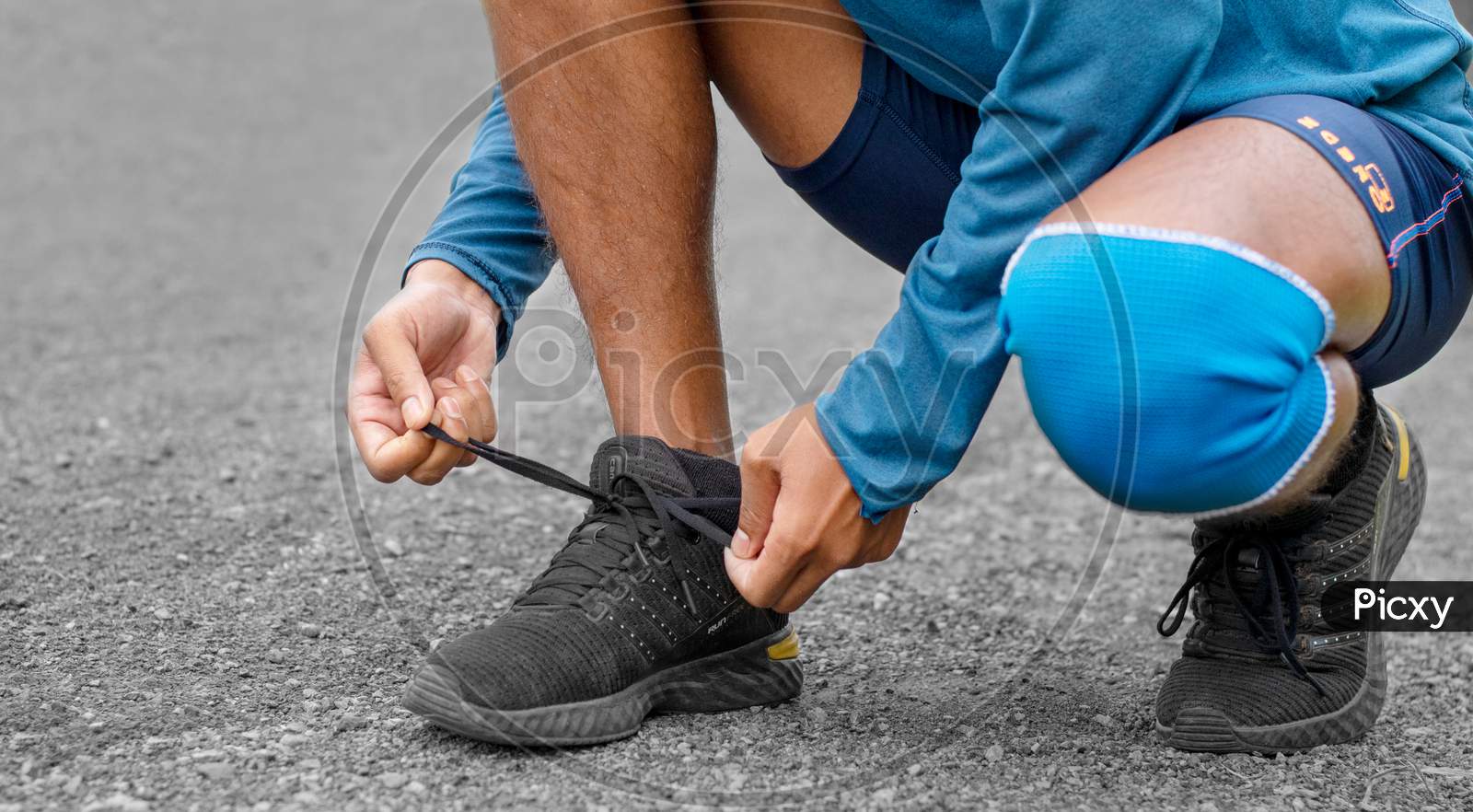 Close Of Athlete Is Shoe Lacing For Being Ready To Exercise.
