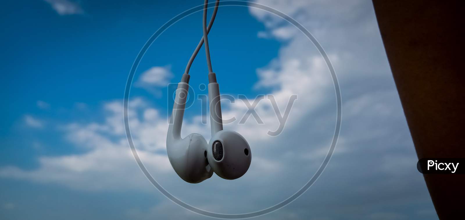 Music earphone hanging out stock photo