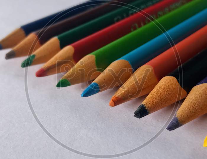 Colored pencils on white paper, multi coloured pencils