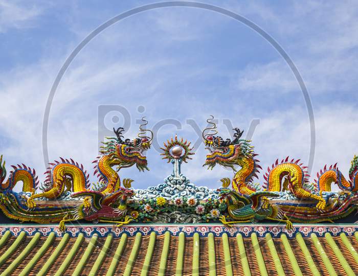 Chinese Dragon On Blue Sky With Cloud