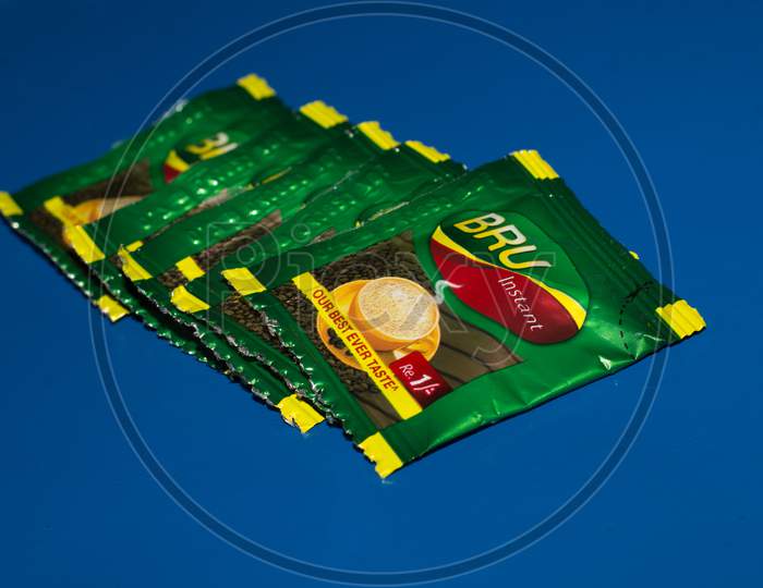Closeup Of Bru Instant Coffee Pack Isolated On Blue Background