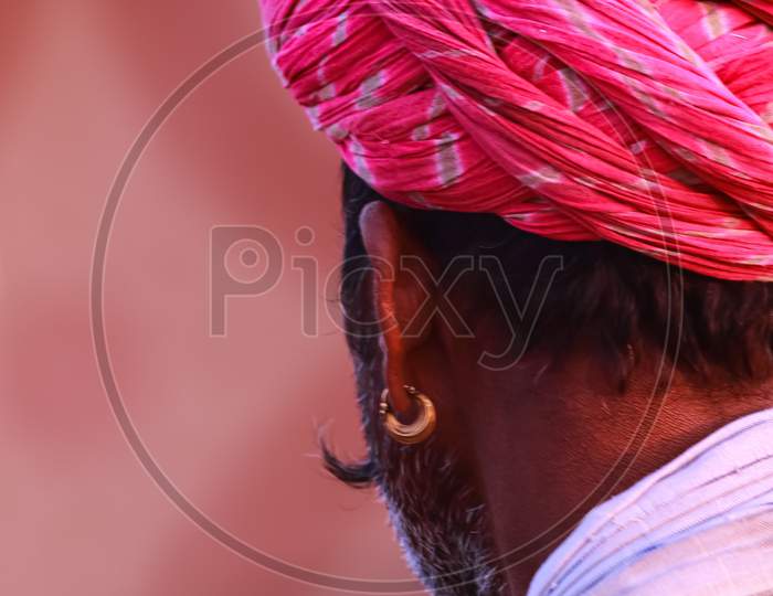 An Abstract side portrait of a Rajasthani man wearing a Pink turban