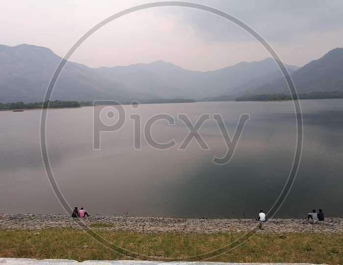 People enjoying the beauty of a dam reservoir Kanjirapuzha,Palakkad, Kerala, India.
