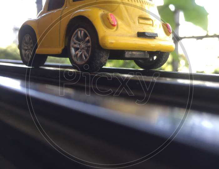 Yellow beetle vintage hot wheels indoor photography