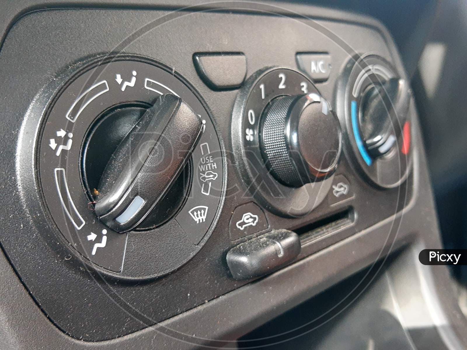 Details And Controls Of Modern Car - Close Up Instrument Automobile Panel With Climat Control View With Air Conditioning Buttons
