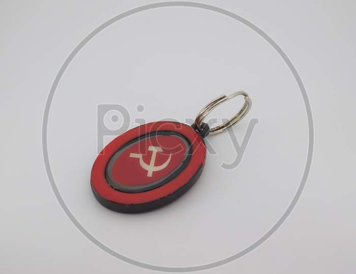 Closeup Of A Red Object Attached With A Ring Isolated On White Background