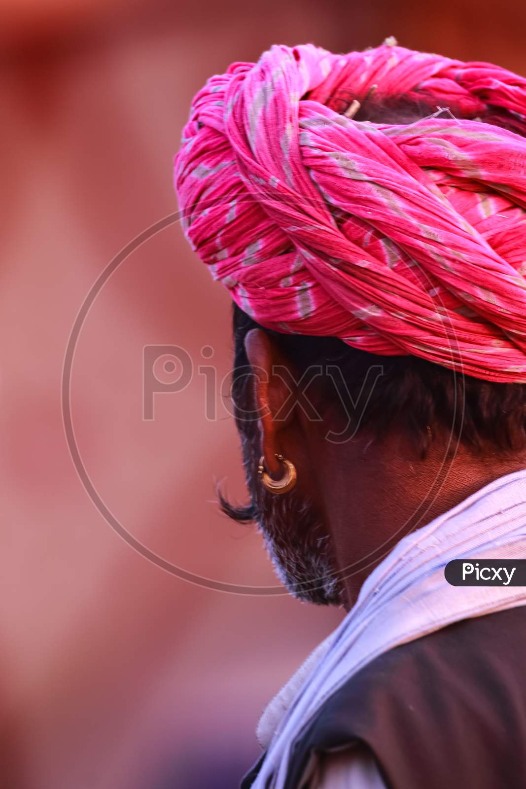 An Abstract side portrait of a Rajasthani man wearing a Pink turban