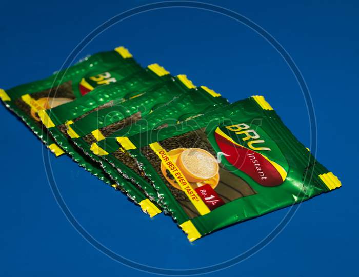 Closeup Of Bru Instant Coffee Pack Isolated On Blue Background
