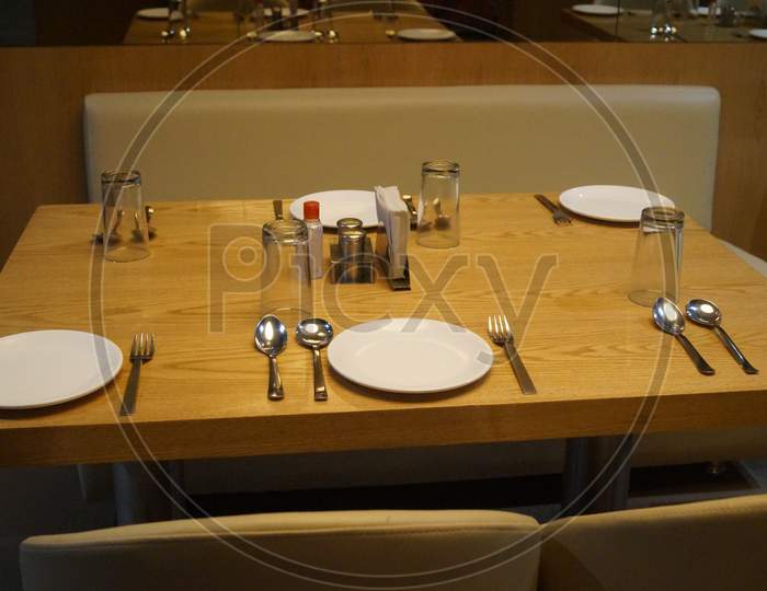 This photo is a hotel photo of India with a table setup.
