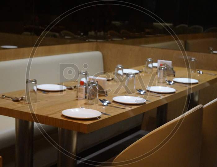 This photo is a hotel photo of India with a table setup.