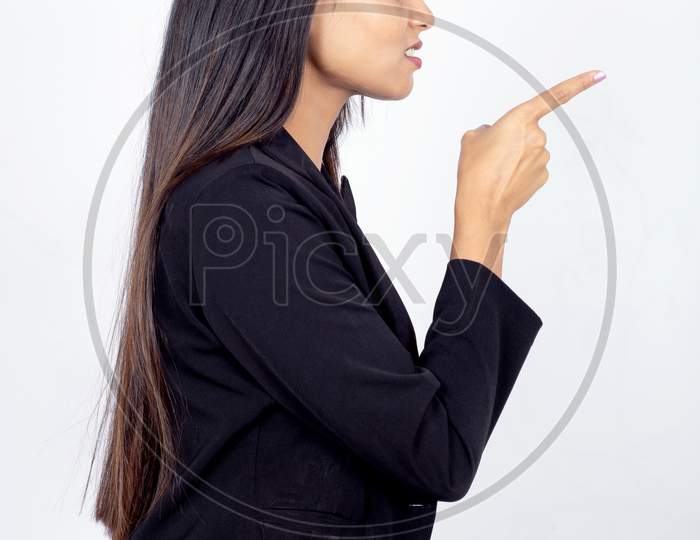 Profile shot of Indian businesswoman giving warning sign