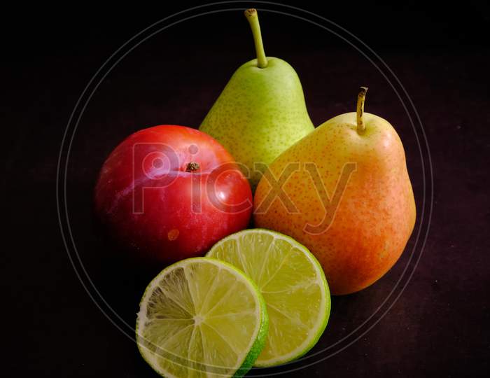 Fresh Healthy Delicious Fruits For Healthy Eating. Colorful Fruits In Dark