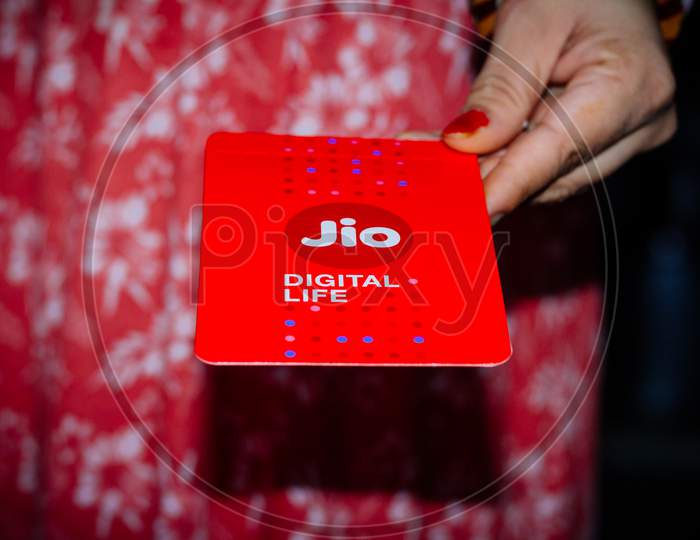 Delhi, India - October 05, 2020 : Jio Sim Cards In Hand With Every Jiofi Or 4G Smartphone