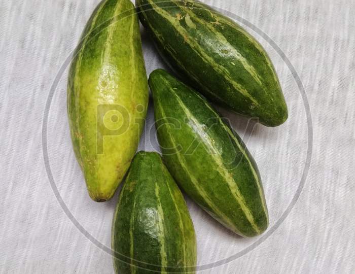 Pointed Gourd or parwal is a green, thin skinned vegetable that has a mild taste and edible crunchy seeds. Popularly used with potato in vegetables, it is also cooked by stuffing with spices