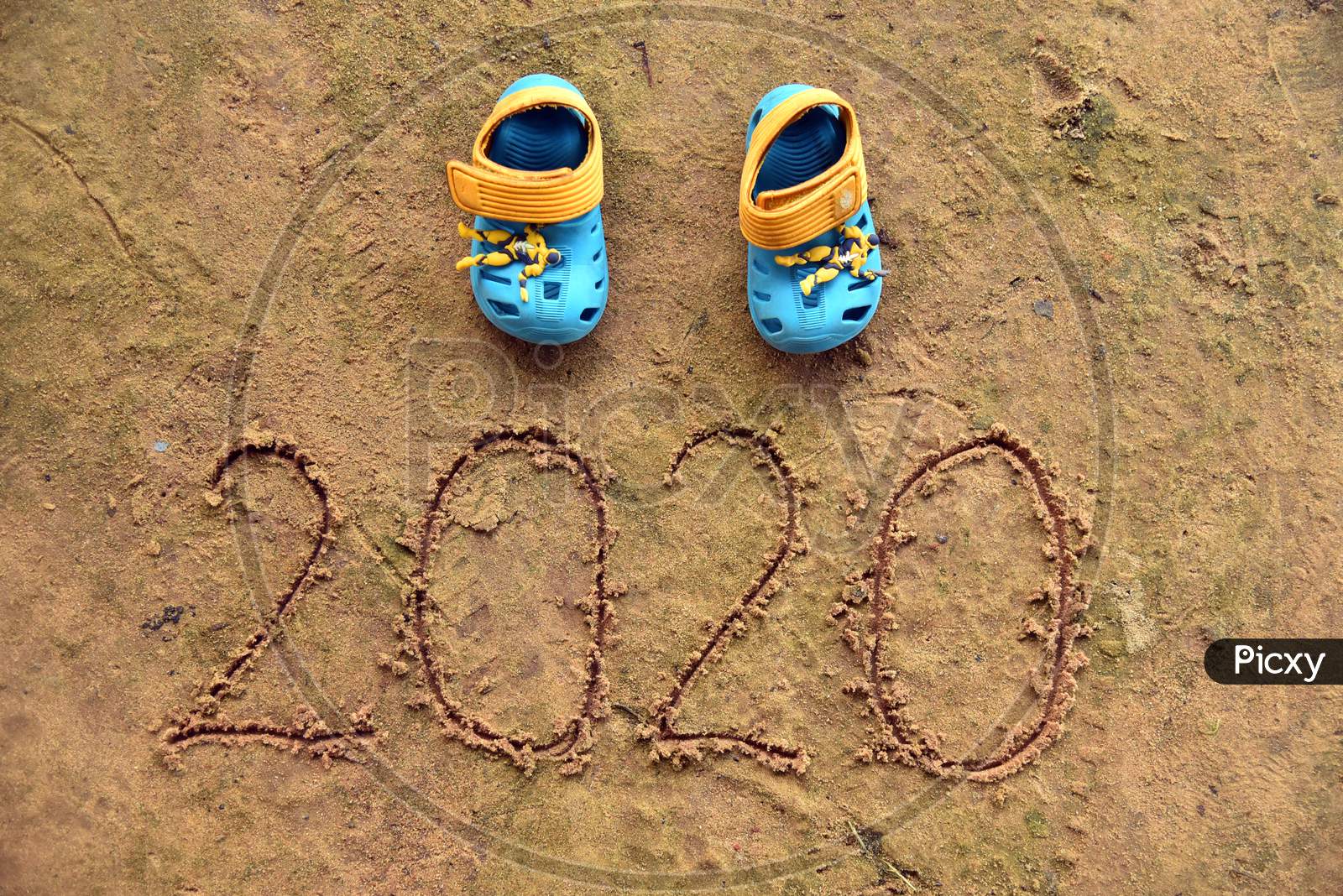 Small Baby Shoes With 2020 Typography .