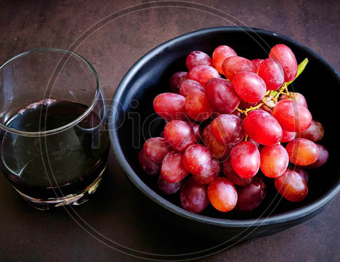 Red Grapes And Wine