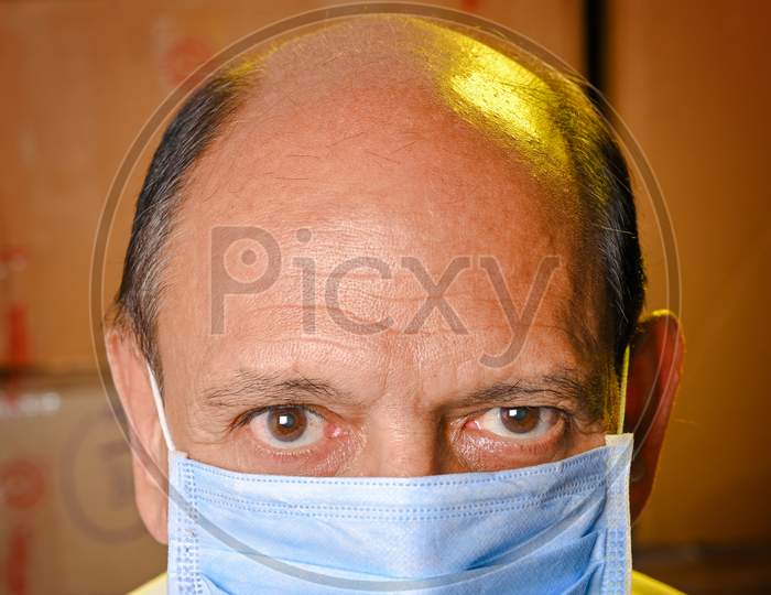 Senior citizen man with mask COVID time