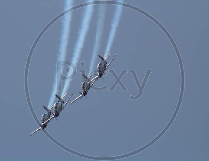 An aircraft demonstration performs stunts in the air