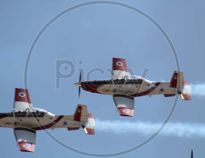 An aircraft demonstration performs stunts in the air