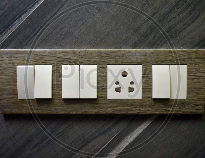 Designer Wooden Electrical Switch Board With 5 Pin Socket Switches On Italian Marble