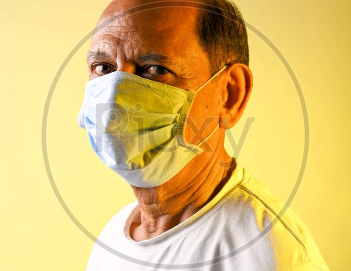 Title: Senior citizen man with mask COVID time